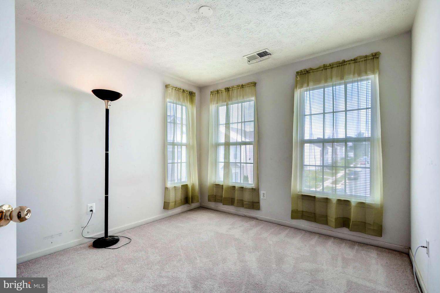 9714 Langley Road Baltimore, MD 21220 - Photo 19 of 27 a view of an empty room with a window