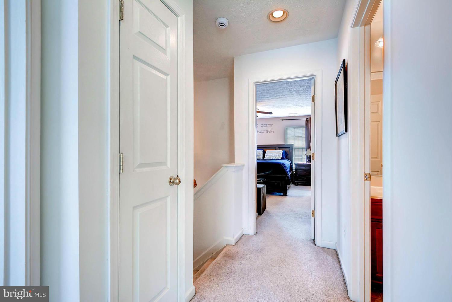 9714 Langley Road Baltimore, MD 21220 - Photo 21 of 27 a view of a bedroom from a hallway