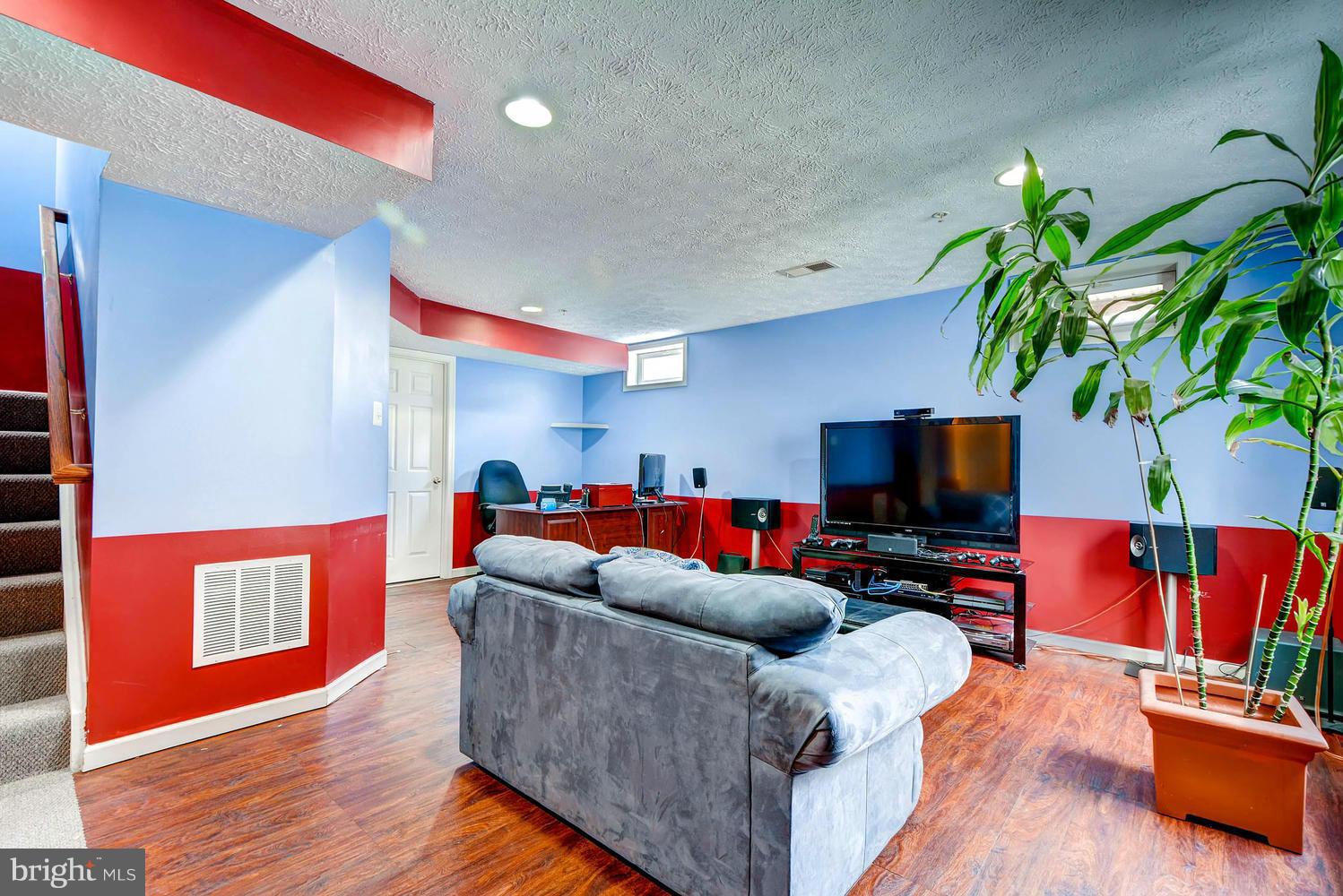 9714 Langley Road Baltimore, MD 21220 - Photo 23 of 27 a living room with furniture and a flat screen tv