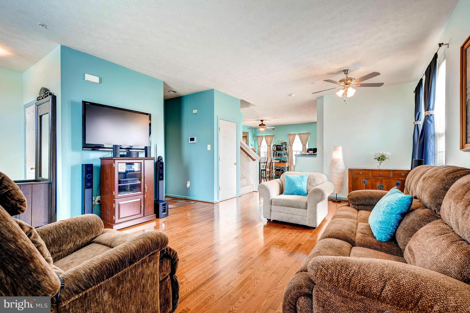 9714 Langley Road Baltimore, MD 21220 - Photo 5 of 27 a living room with furniture and a flat screen tv
