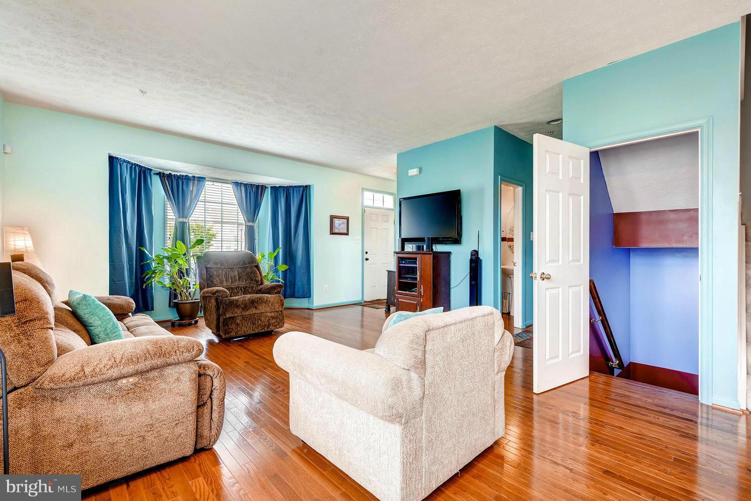 9714 Langley Road Baltimore, MD 21220 - Photo 6 of 27 a living room with furniture and a flat screen tv