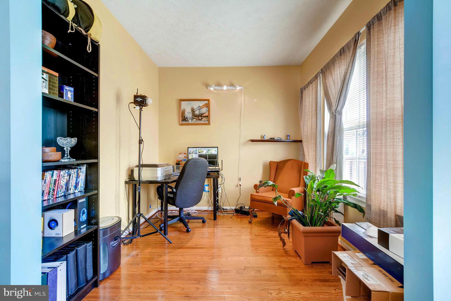 9714 Langley Road Baltimore, MD 21220 - Photo 7 of 27 a living room with furniture and a potted plant