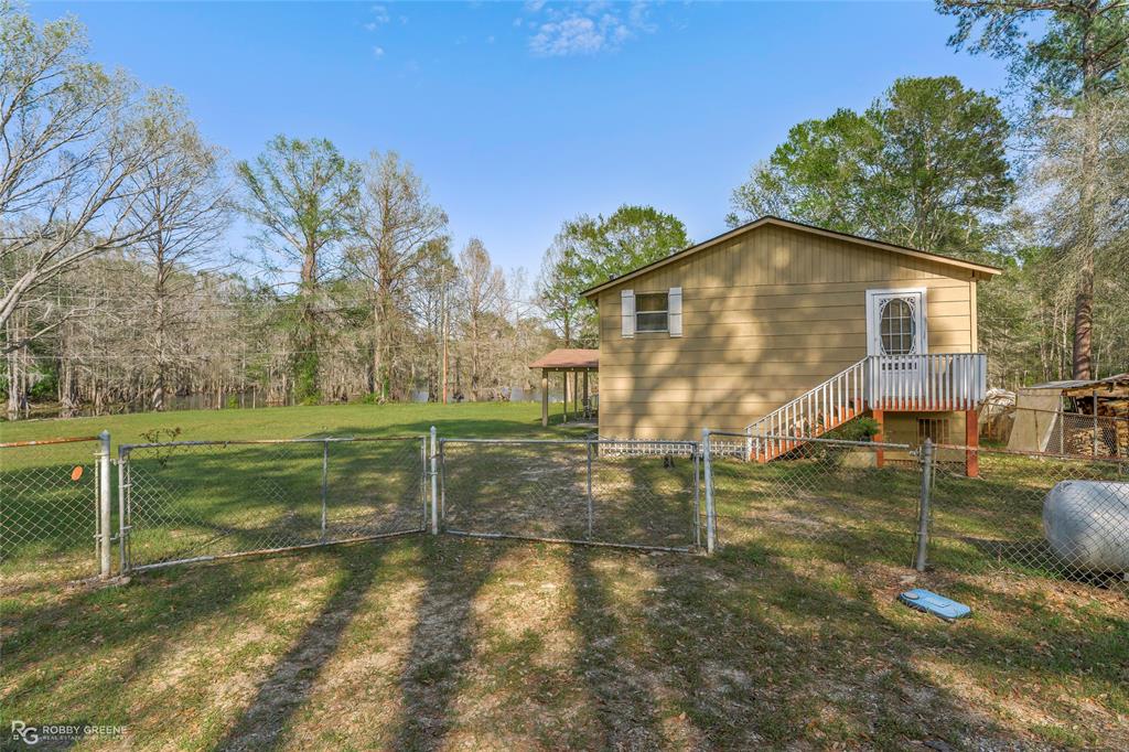 121 Willow Street Heflin, LA 71039 - Photo 13 of 39 a view of a house with backyard