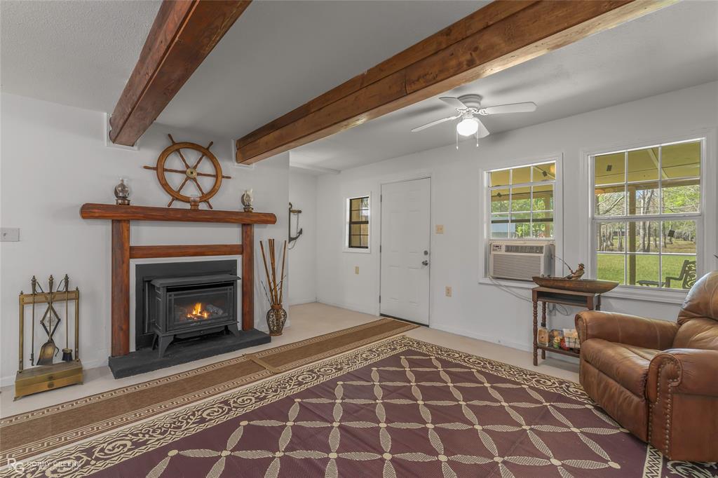 121 Willow Street Heflin, LA 71039 - Photo 15 of 39 a living room with furniture and a fireplace