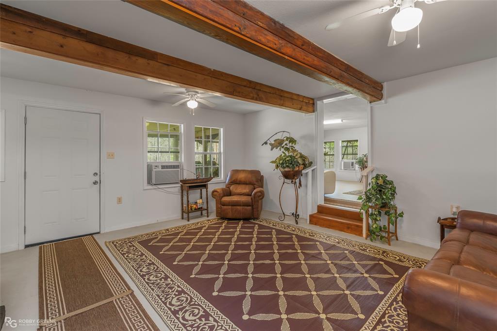 121 Willow Street Heflin, LA 71039 - Photo 16 of 39 a living room with a rug and a window
