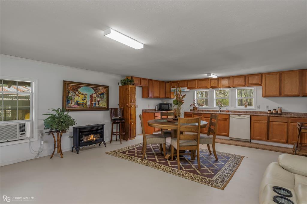 121 Willow Street Heflin, LA 71039 - Photo 20 of 39 a dining room with furniture and a kitchen view
