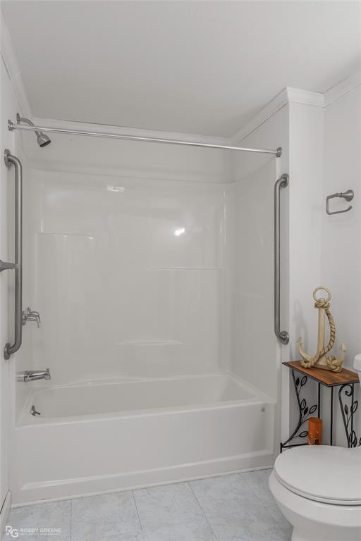 121 Willow Street Heflin, LA 71039 - Photo 23 of 39 a bathroom with a bathtub and a shower