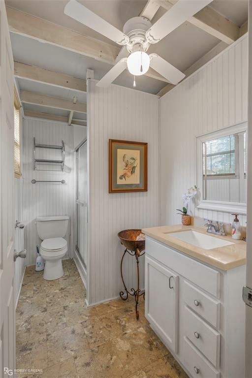 121 Willow Street Heflin, LA 71039 - Photo 26 of 39 a view of a bathroom with a sink a toilet and a mirror