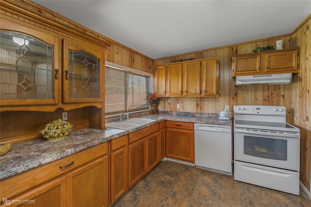 121 Willow Street Heflin, LA 71039 - Photo 27 of 39 a kitchen that has a sink and a stove