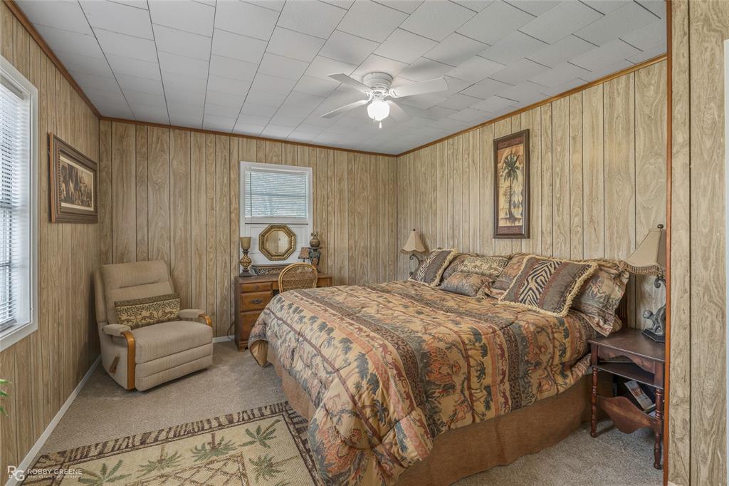 121 Willow Street Heflin, LA 71039 - Photo 31 of 39 a bedroom with a bed and a couch