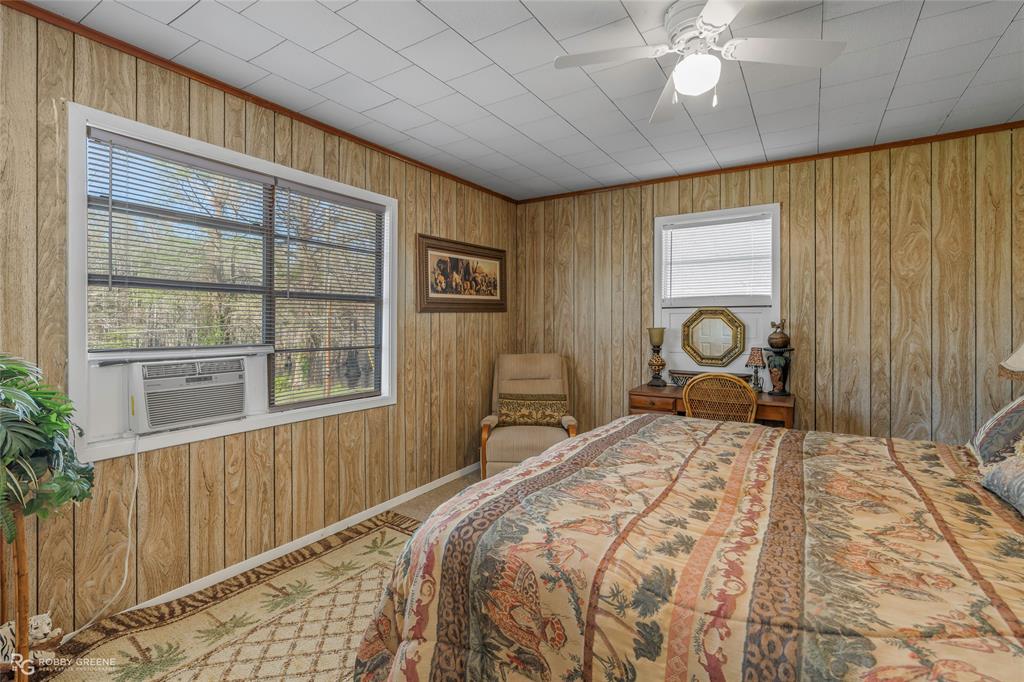 121 Willow Street Heflin, LA 71039 - Photo 32 of 39 a bedroom with a bed and a window