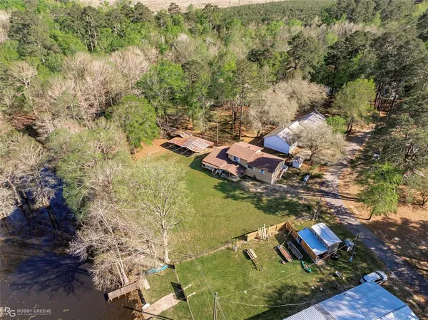 an aerial view of residential houses with outdoor space