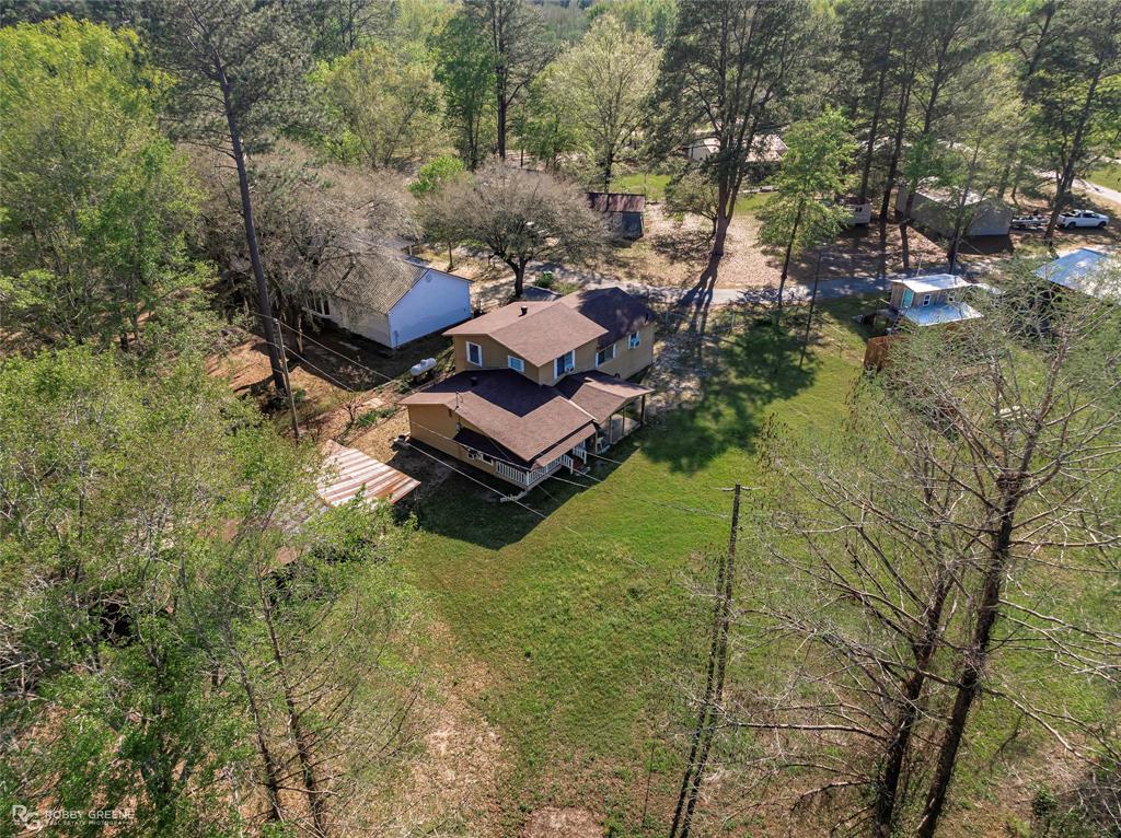 121 Willow Street Heflin, LA 71039 - Photo 4 of 39 a aerial view of a house with pool yard large trees and outdoor seating