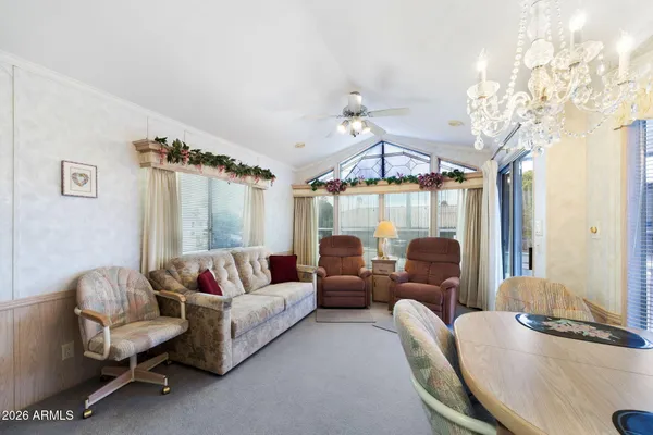 a living room with furniture and a large window