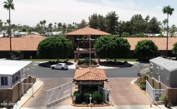 a view of backyard with swimming pool and outdoor seating