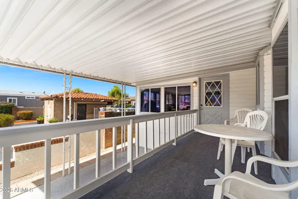 a view of a patio with couches chairs and potted plants