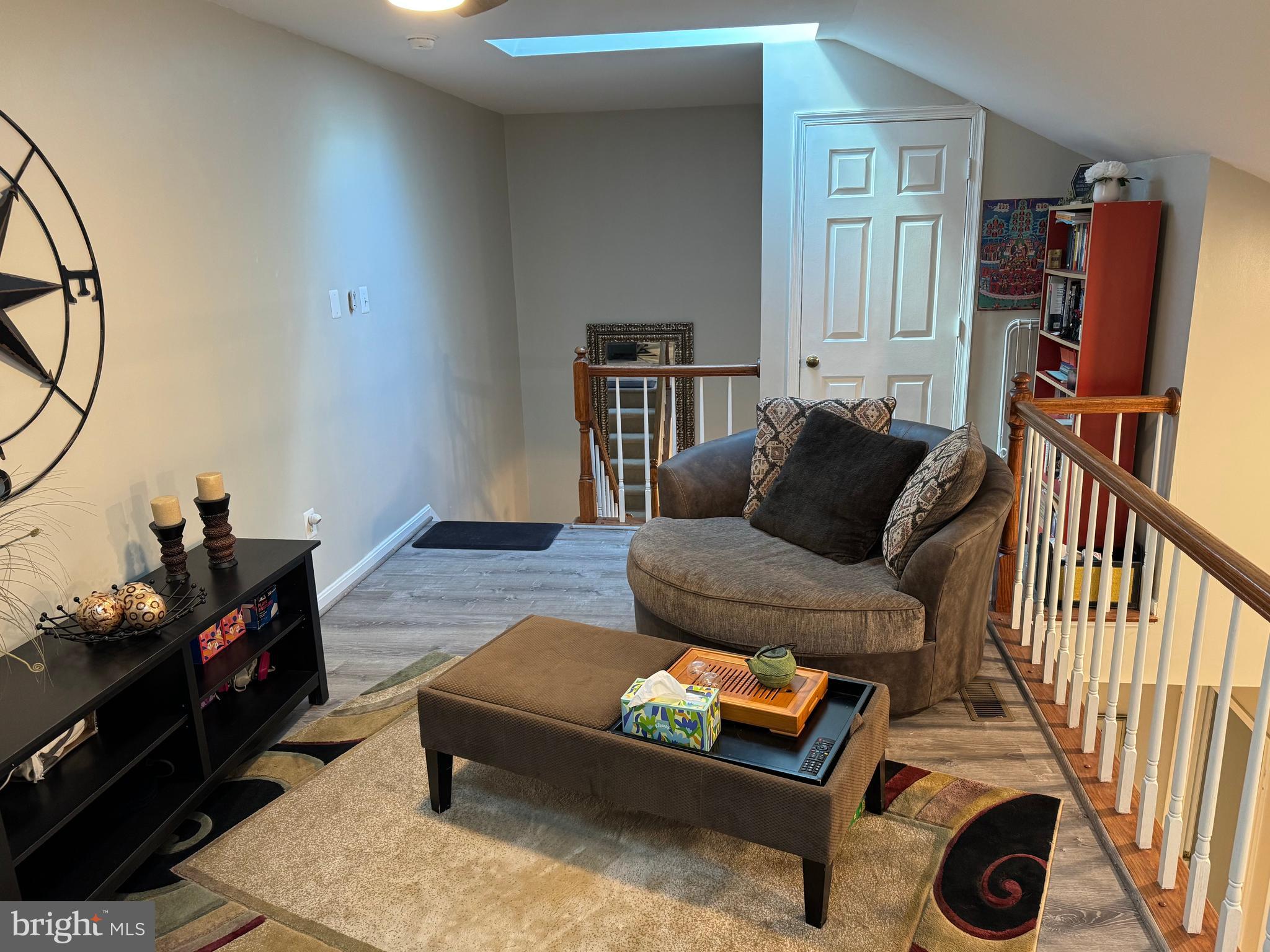 11709 Karbon Hill Court, Unit I Reston, VA 20191 - Photo 15 of 38 a living room with furniture and a flat screen tv