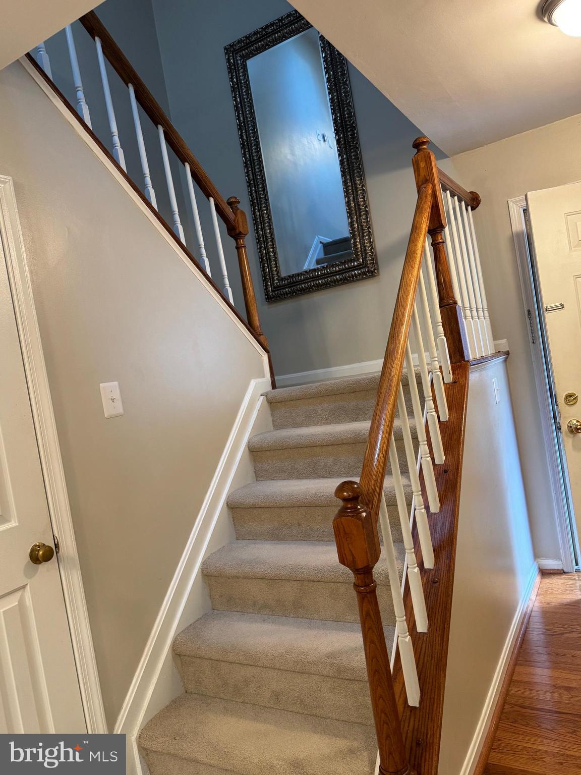 11709 Karbon Hill Court, Unit I Reston, VA 20191 - Photo 19 of 38 a view of staircase with wooden floor and a potted plant