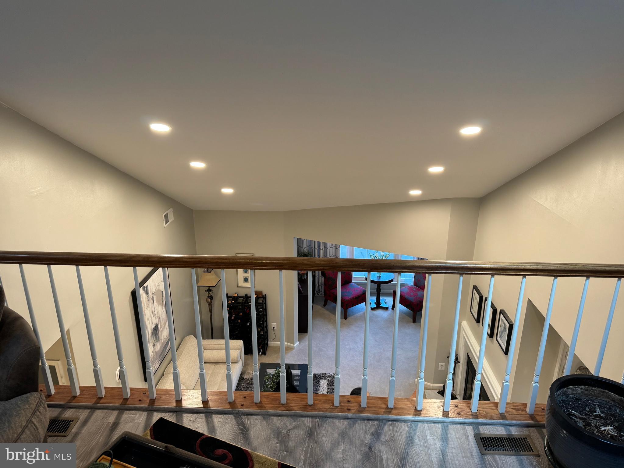 11709 Karbon Hill Court, Unit I Reston, VA 20191 - Photo 20 of 38 a view of a hallway with wooden floor and stairs