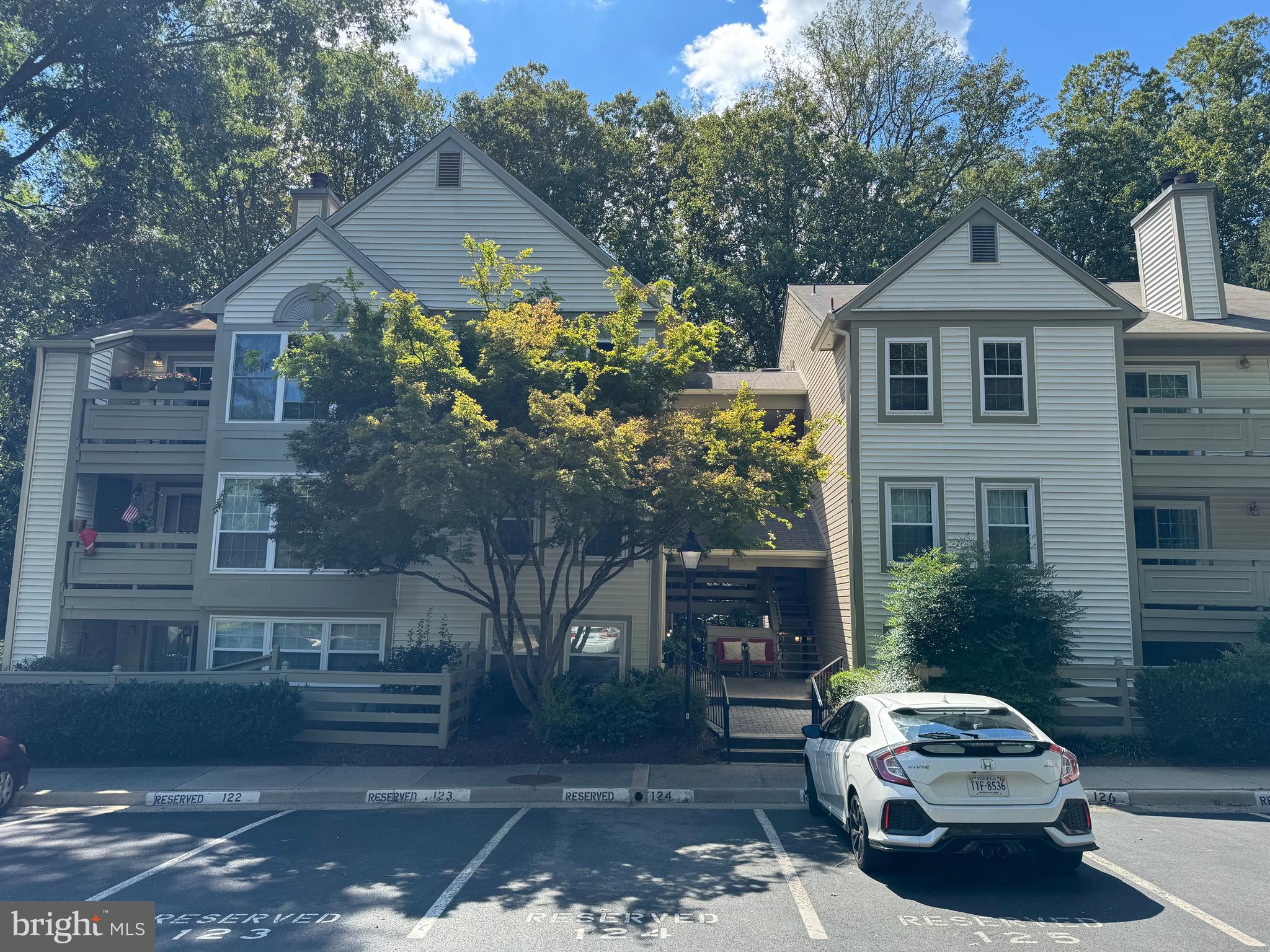 11709 Karbon Hill Court, Unit I Reston, VA 20191 - Photo 2 of 38 a front view of a house with a yard