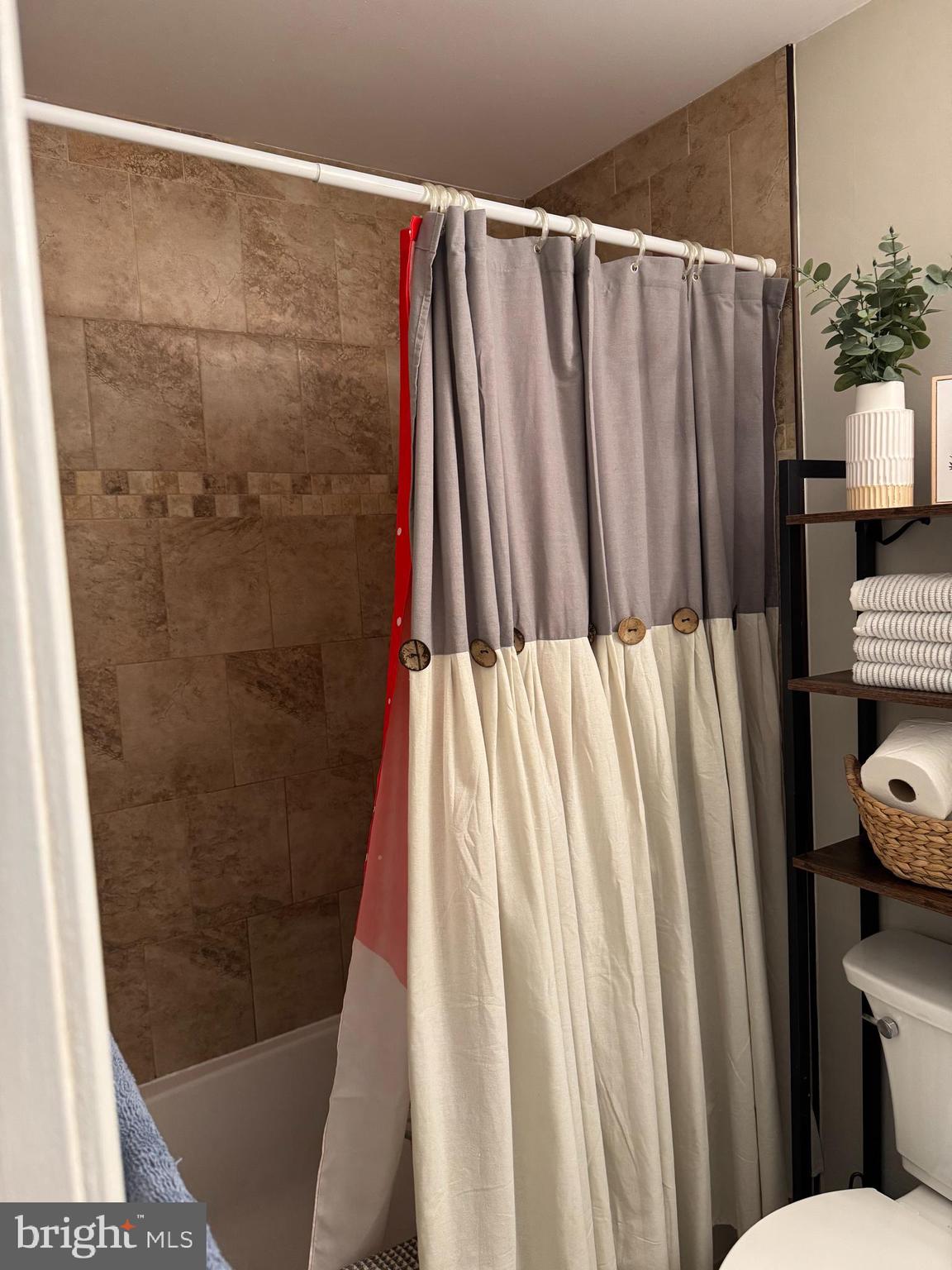 11709 Karbon Hill Court, Unit I Reston, VA 20191 - Photo 29 of 38 a bathroom with a shower and a toilet