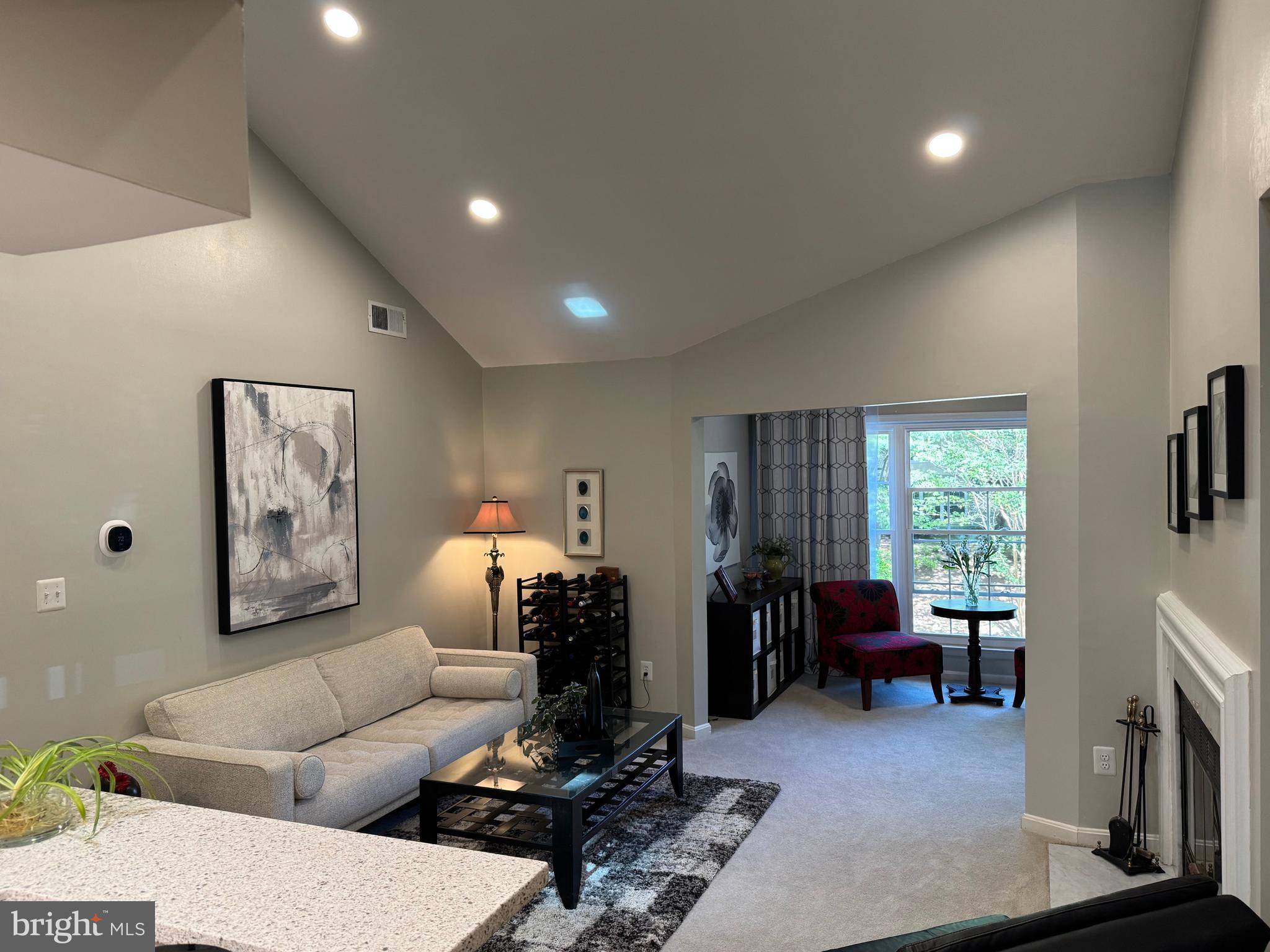 11709 Karbon Hill Court, Unit I Reston, VA 20191 - Photo 3 of 38 a living room with furniture and a window