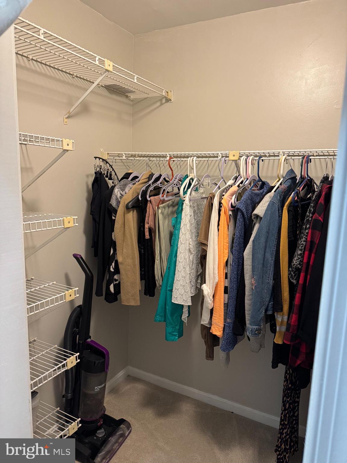 11709 Karbon Hill Court, Unit I Reston, VA 20191 - Photo 32 of 38 a view of walk in closet with clothes