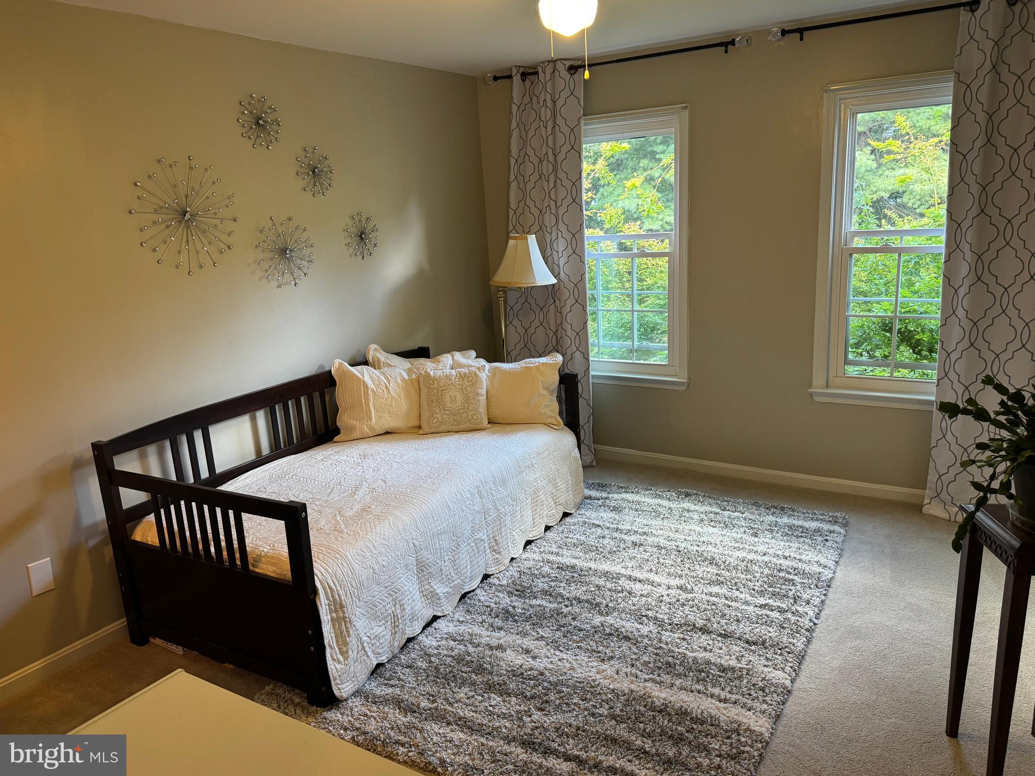 11709 Karbon Hill Court, Unit I Reston, VA 20191 - Photo 34 of 38 a bedroom with a bed and a window