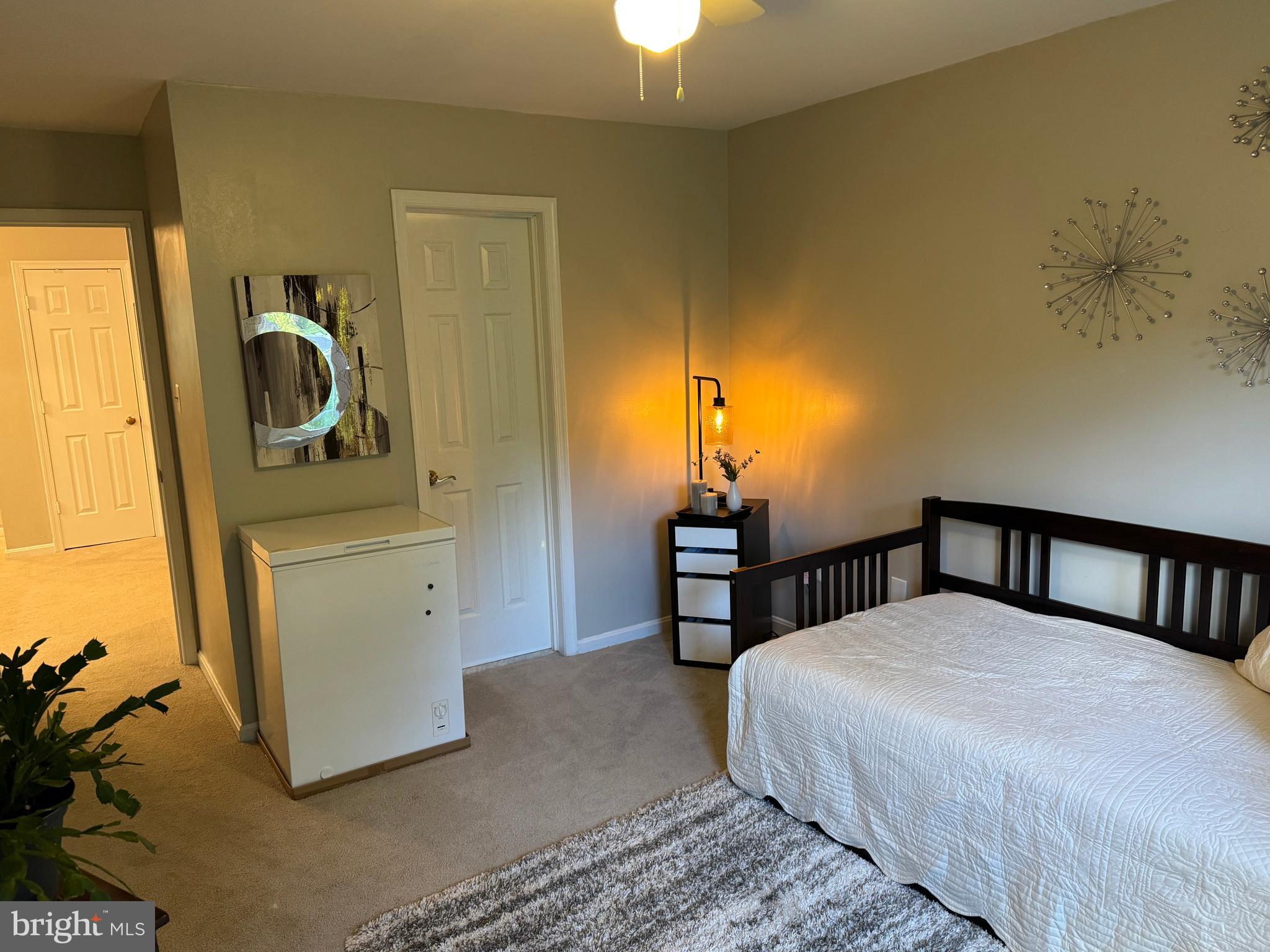 11709 Karbon Hill Court, Unit I Reston, VA 20191 - Photo 36 of 38 a bedroom with a bed and a window