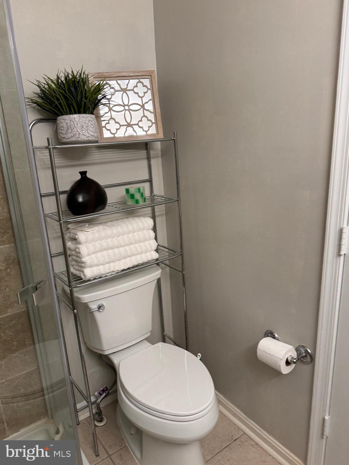 11709 Karbon Hill Court, Unit I Reston, VA 20191 - Photo 38 of 38 a bathroom with a toilet a sink and a window