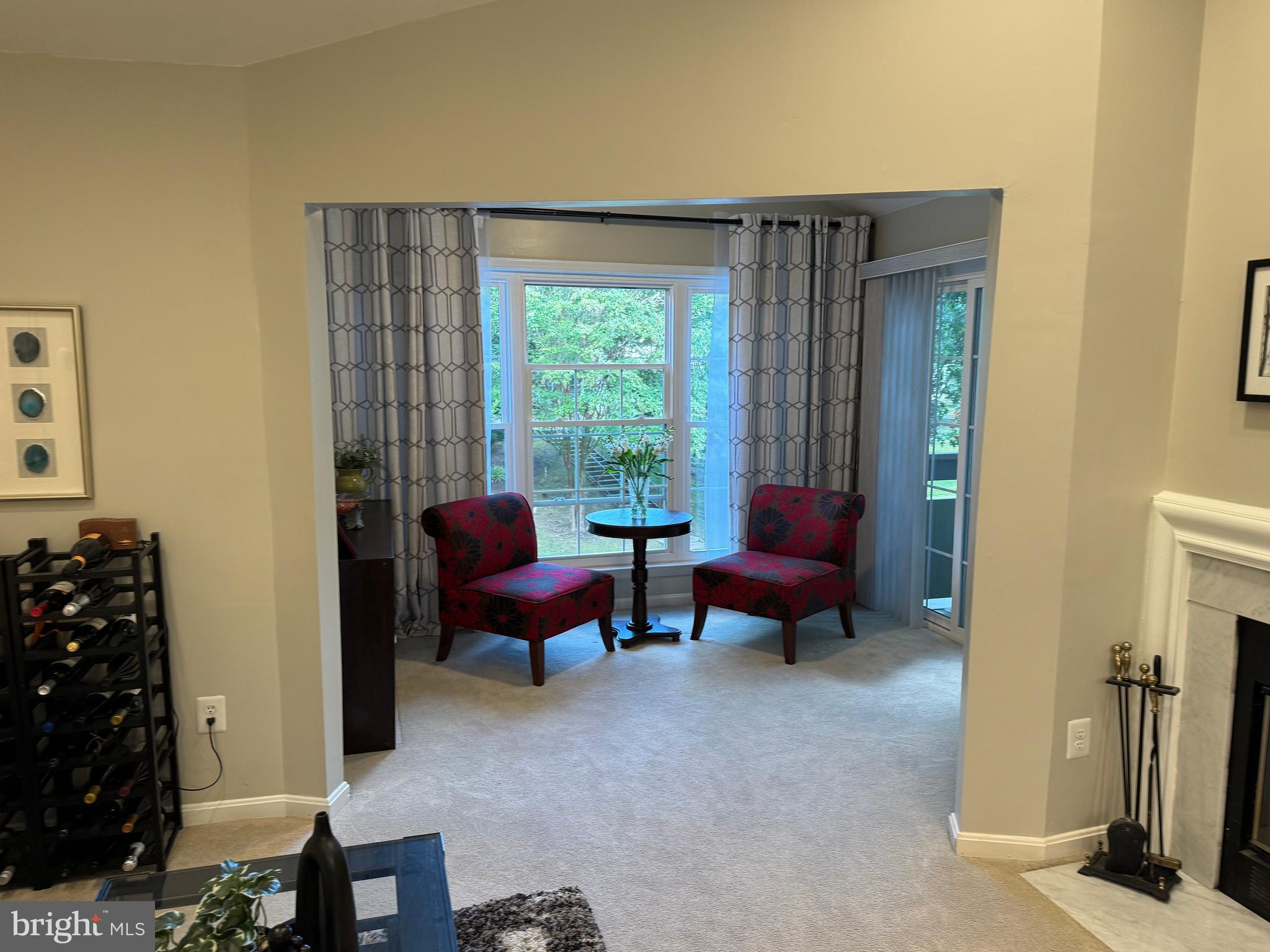 11709 Karbon Hill Court, Unit I Reston, VA 20191 - Photo 9 of 38 a living room with furniture and a window