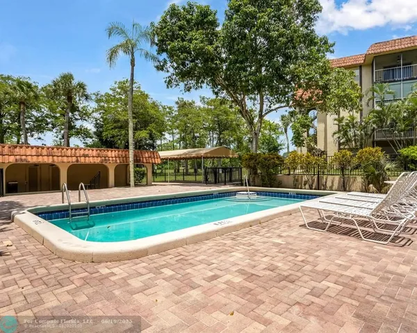 a view of fountain with swimming pool