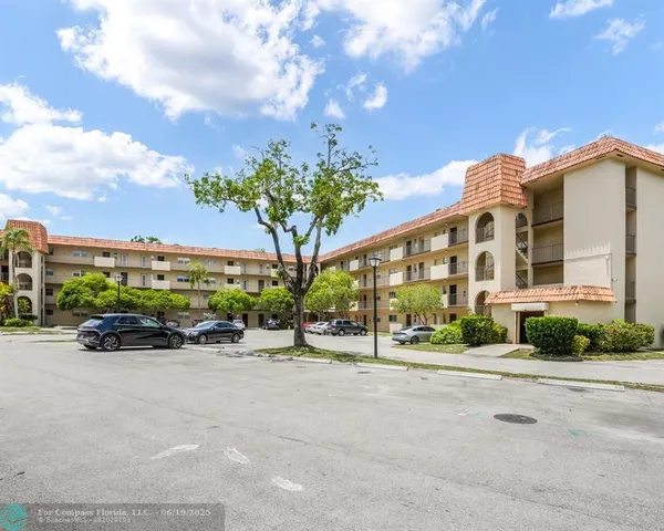 a front view of a building with garden