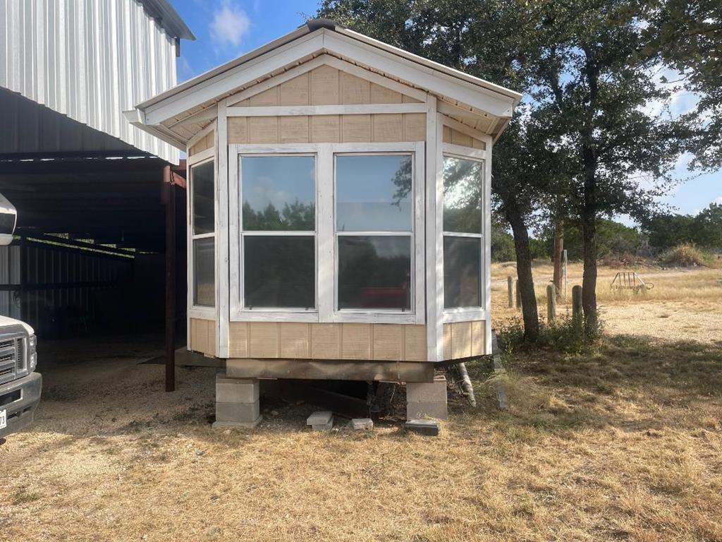 a view of house with yard