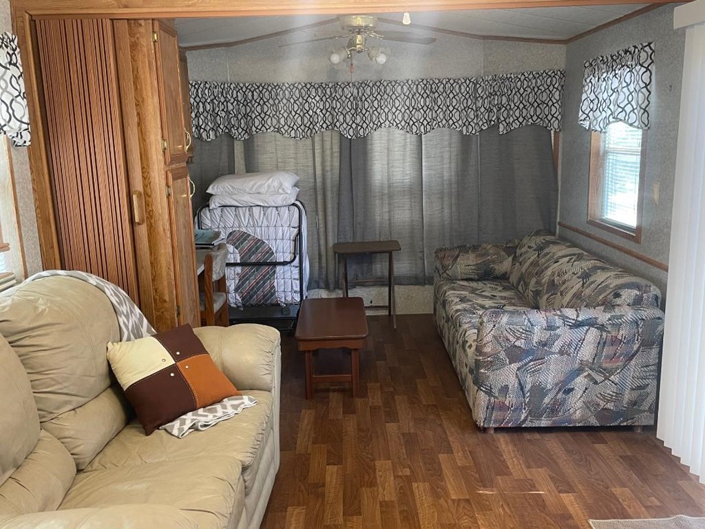 19831 West Rr 337 Camp Camp Wood, TX 78833 - Photo 16 of 27 a living room with furniture and a fireplace