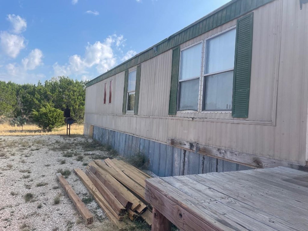19831 West Rr 337 Camp Camp Wood, TX 78833 - Photo 19 of 27 a view of backyard with wooden fence and large trees