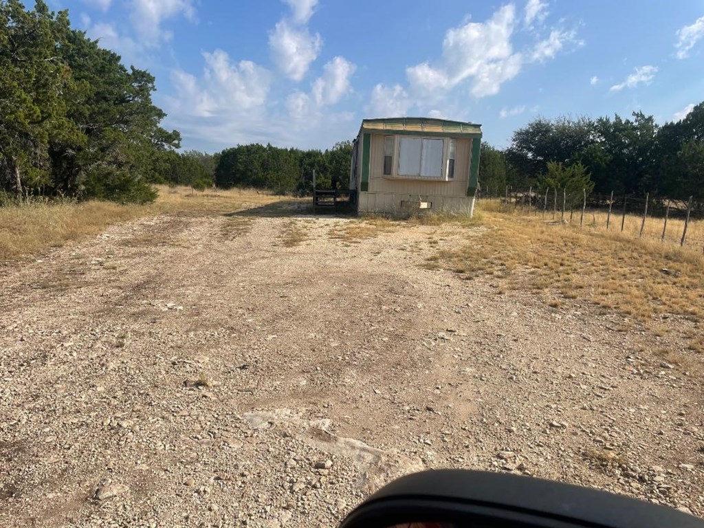 19831 West Rr 337 Camp Camp Wood, TX 78833 - Photo 20 of 27 a view of a house with a yard