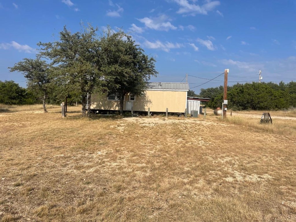 19831 West Rr 337 Camp Camp Wood, TX 78833 - Photo 2 of 27 a view of a lake with a yard