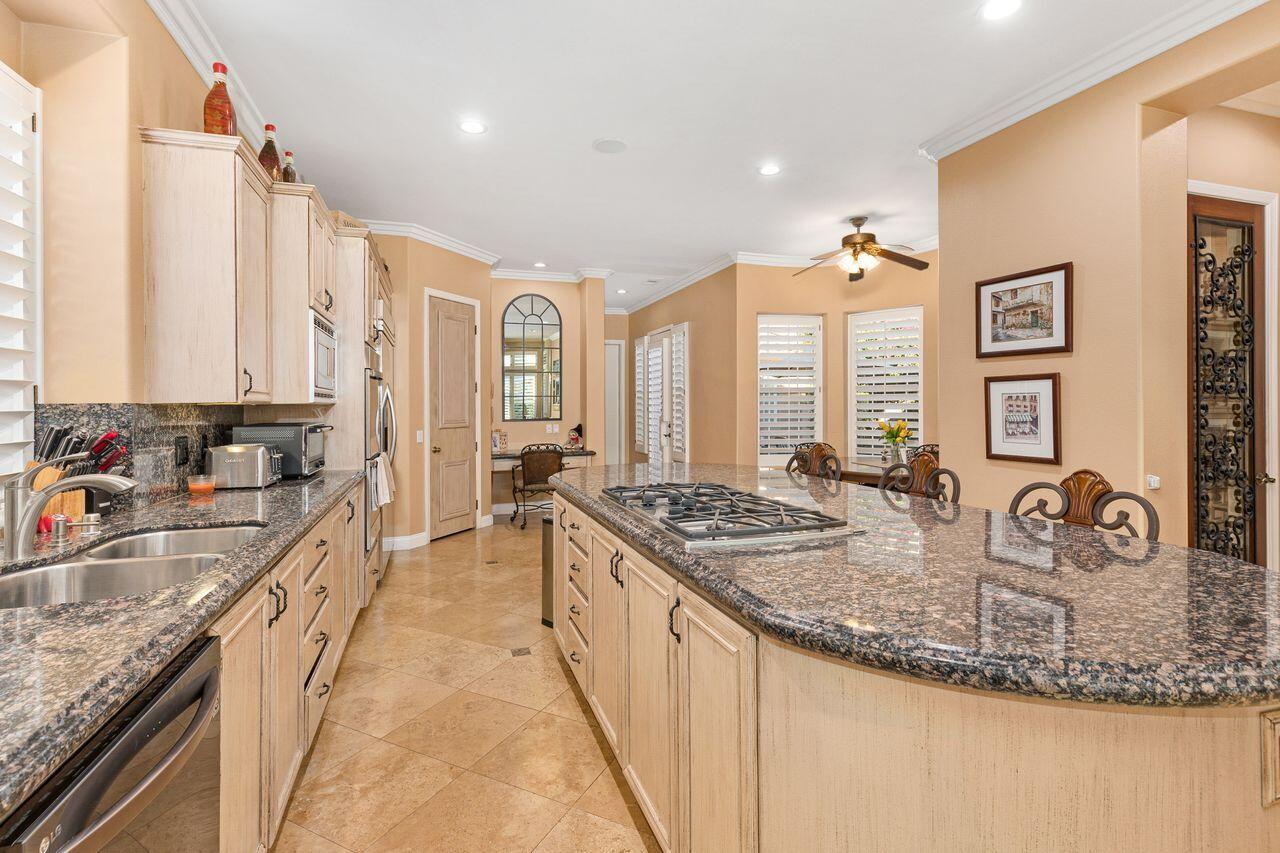 20 Vista Encantada Rancho Mirage, CA 92270 - Photo 12 of 37 a kitchen with sink stove and cabinets