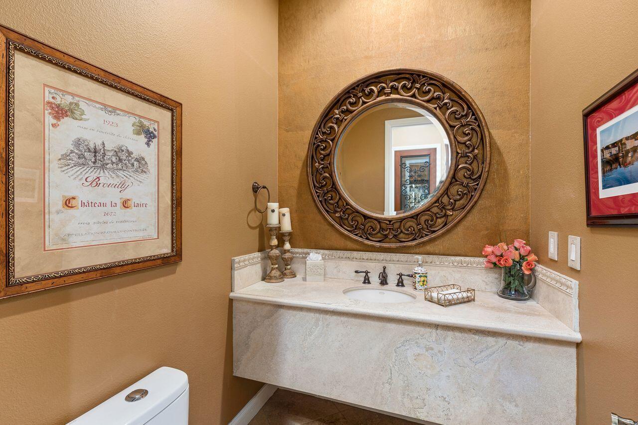 20 Vista Encantada Rancho Mirage, CA 92270 - Photo 14 of 37 a bathroom with a sink mirror and vanity