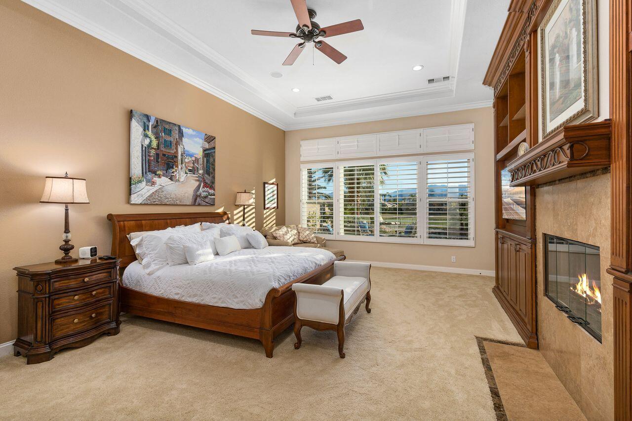20 Vista Encantada Rancho Mirage, CA 92270 - Photo 16 of 37 a bedroom with a bed dresser and a window