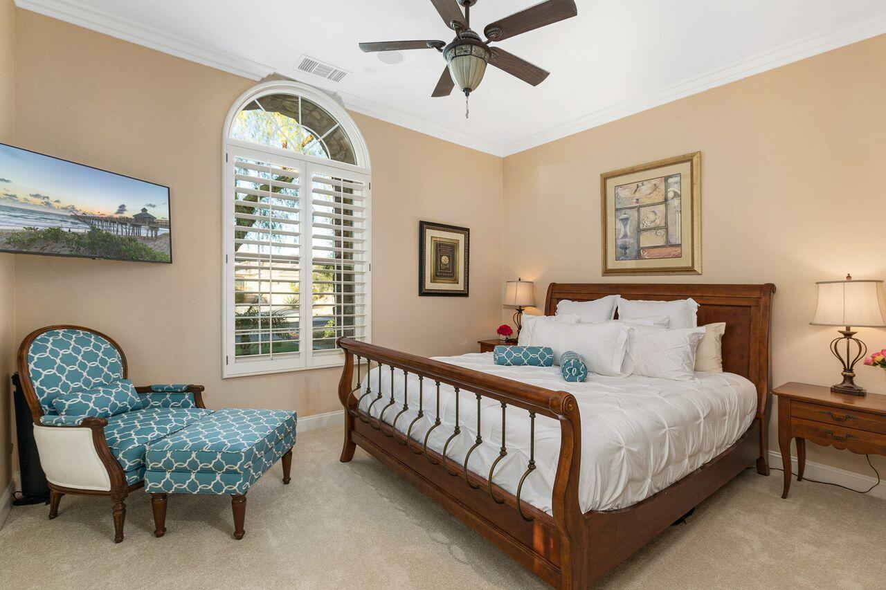 20 Vista Encantada Rancho Mirage, CA 92270 - Photo 21 of 37 a bed sitting in a bedroom next to a window