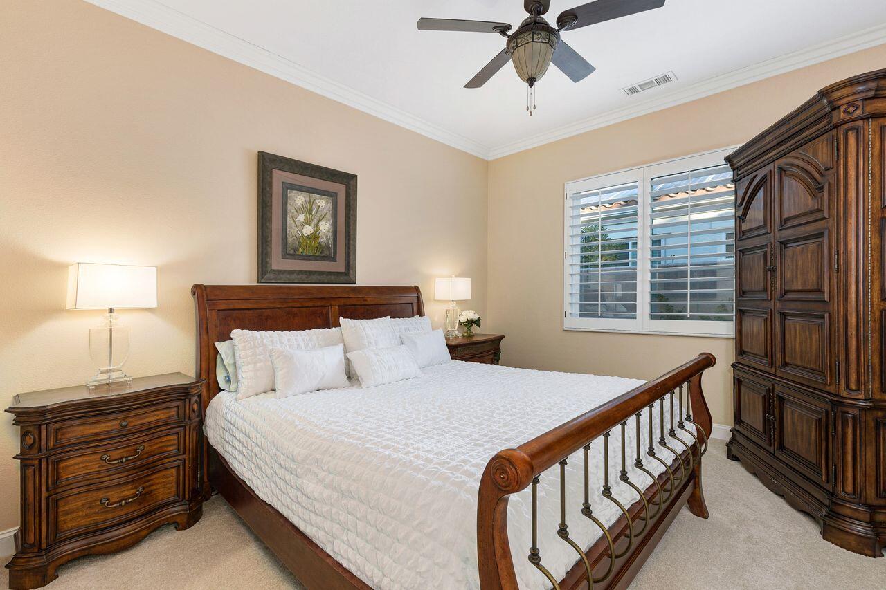 20 Vista Encantada Rancho Mirage, CA 92270 - Photo 23 of 37 a bedroom with a bed and a window