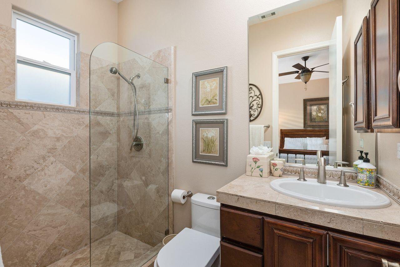 20 Vista Encantada Rancho Mirage, CA 92270 - Photo 24 of 37 a bathroom with a granite countertop toilet sink shower and mirror