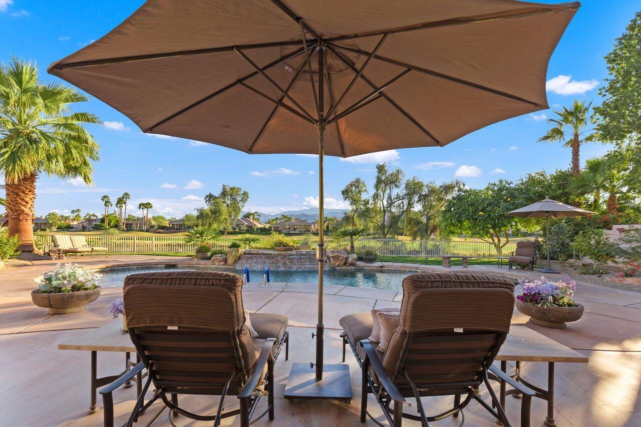 20 Vista Encantada Rancho Mirage, CA 92270 - Photo 25 of 37 a view of an outdoor space with furniture and umbrella