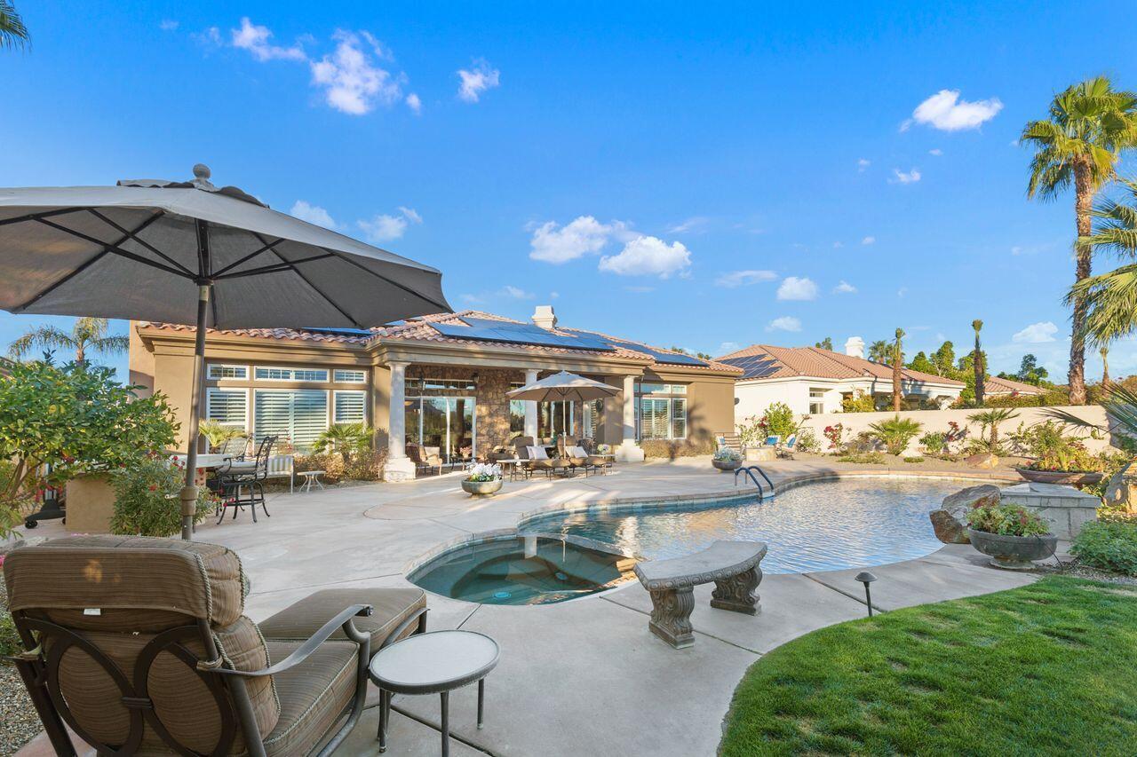 20 Vista Encantada Rancho Mirage, CA 92270 - Photo 27 of 37 a view of a patio with couches and table under an umbrella