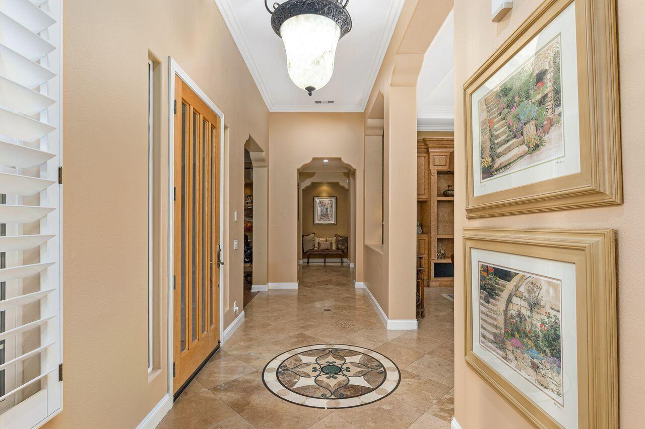 20 Vista Encantada Rancho Mirage, CA 92270 - Photo 5 of 37 a view of a hallway with wooden floor and living room