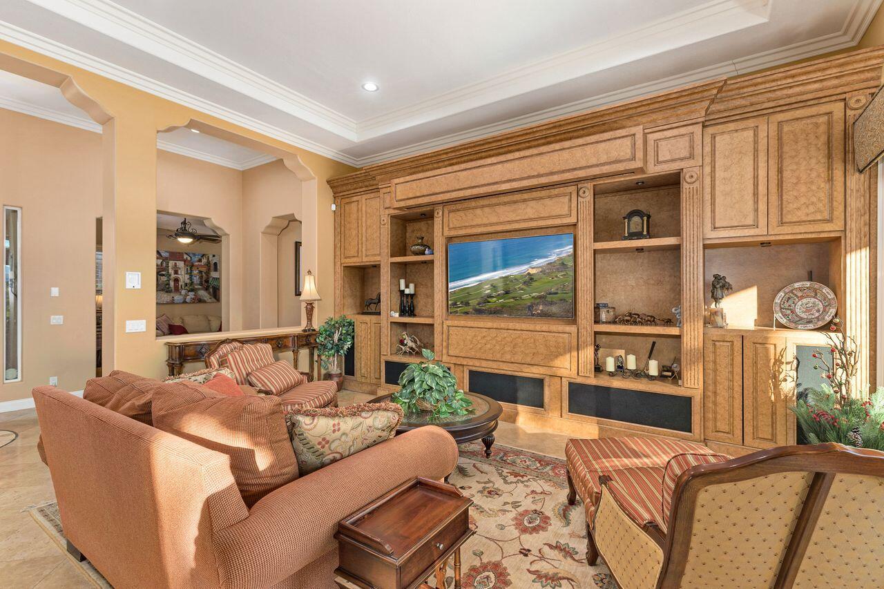 20 Vista Encantada Rancho Mirage, CA 92270 - Photo 7 of 37 a living room with furniture wooden floor and a large window