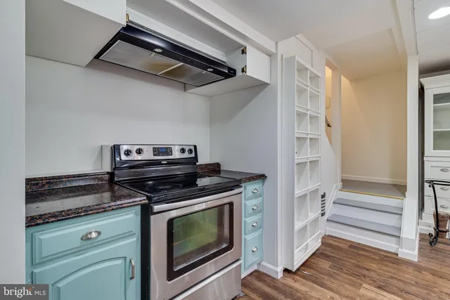a view of a storage and utility room with racks on the wall