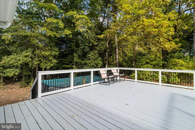 a view of a balcony with chairs